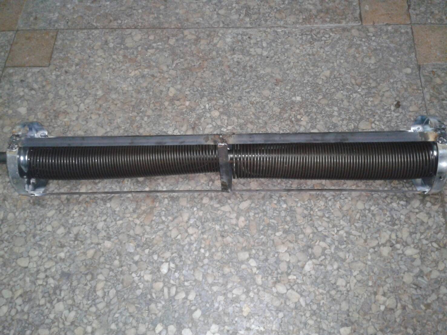 手拉捲門彈簧，斷裂，換新